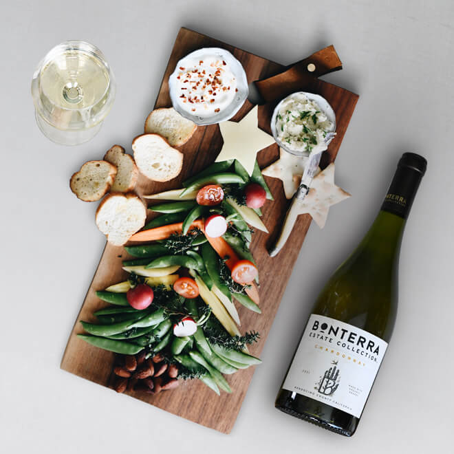 grazing board featuring vegetables shaped like a christmas tree